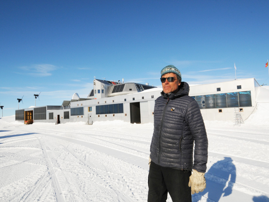 Alain Hubert in front of the Princess Elisabeth Antarctica.
