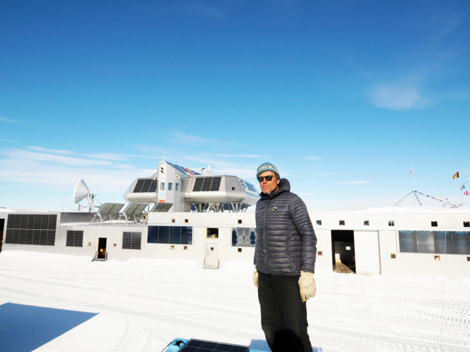Alain Hubert in front of the Princess Elisabeth Antarctica.