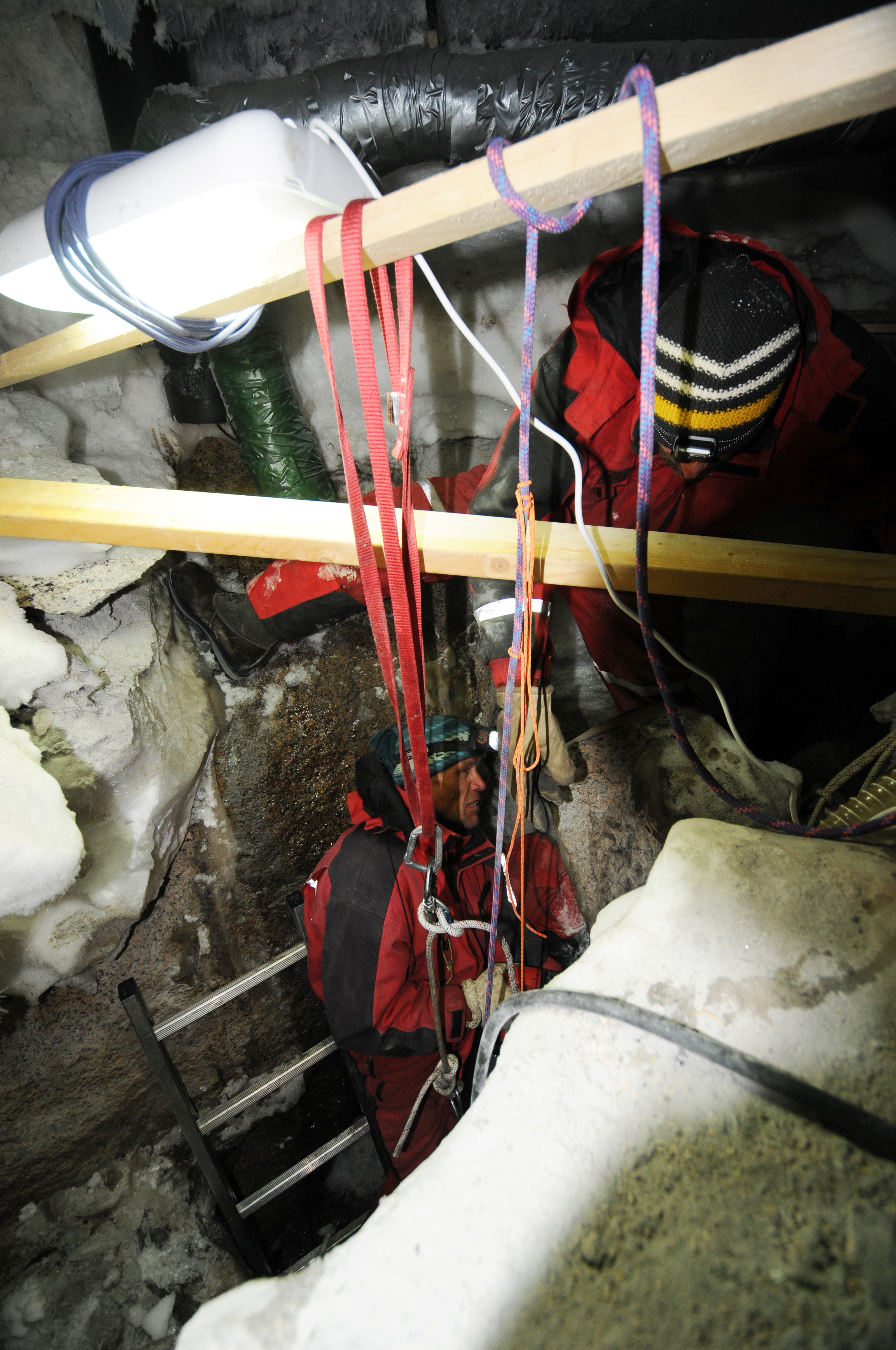 Alain Hubert removing ice from treated water crevasse