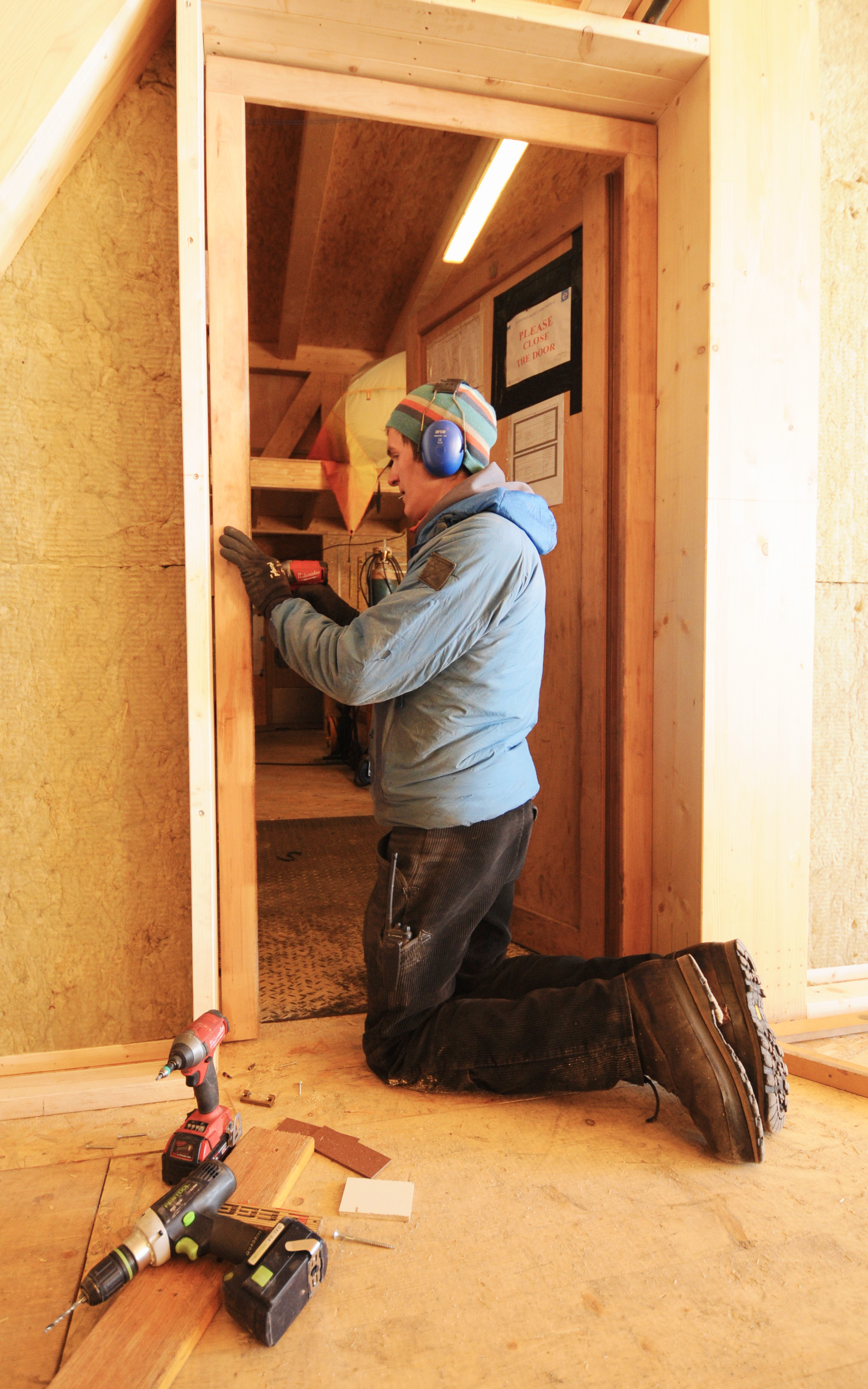 Tom installs all the doors in PEA's new garage
