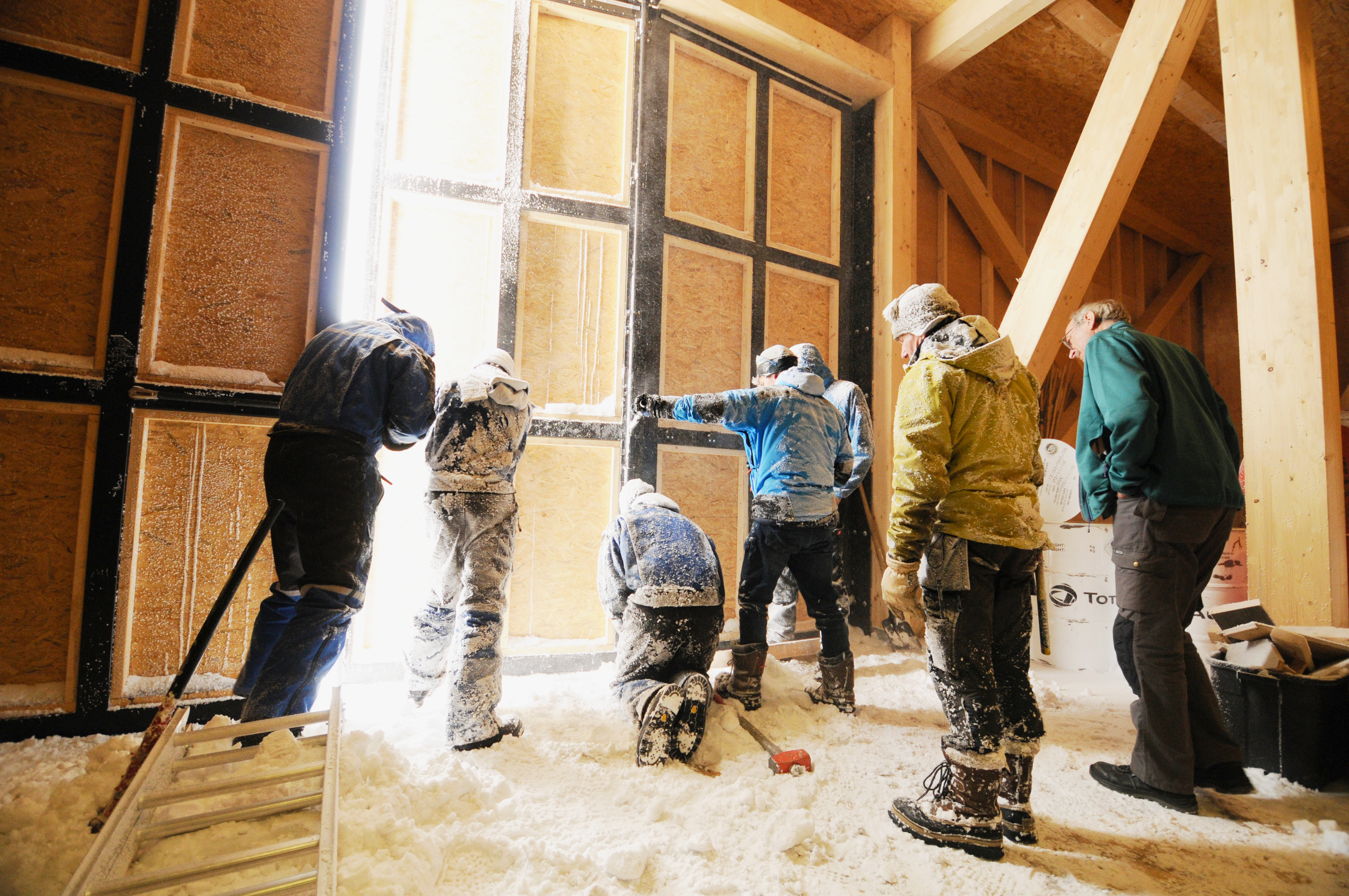 IPF BELARE team making adjustments to main door of PEA's new garage
