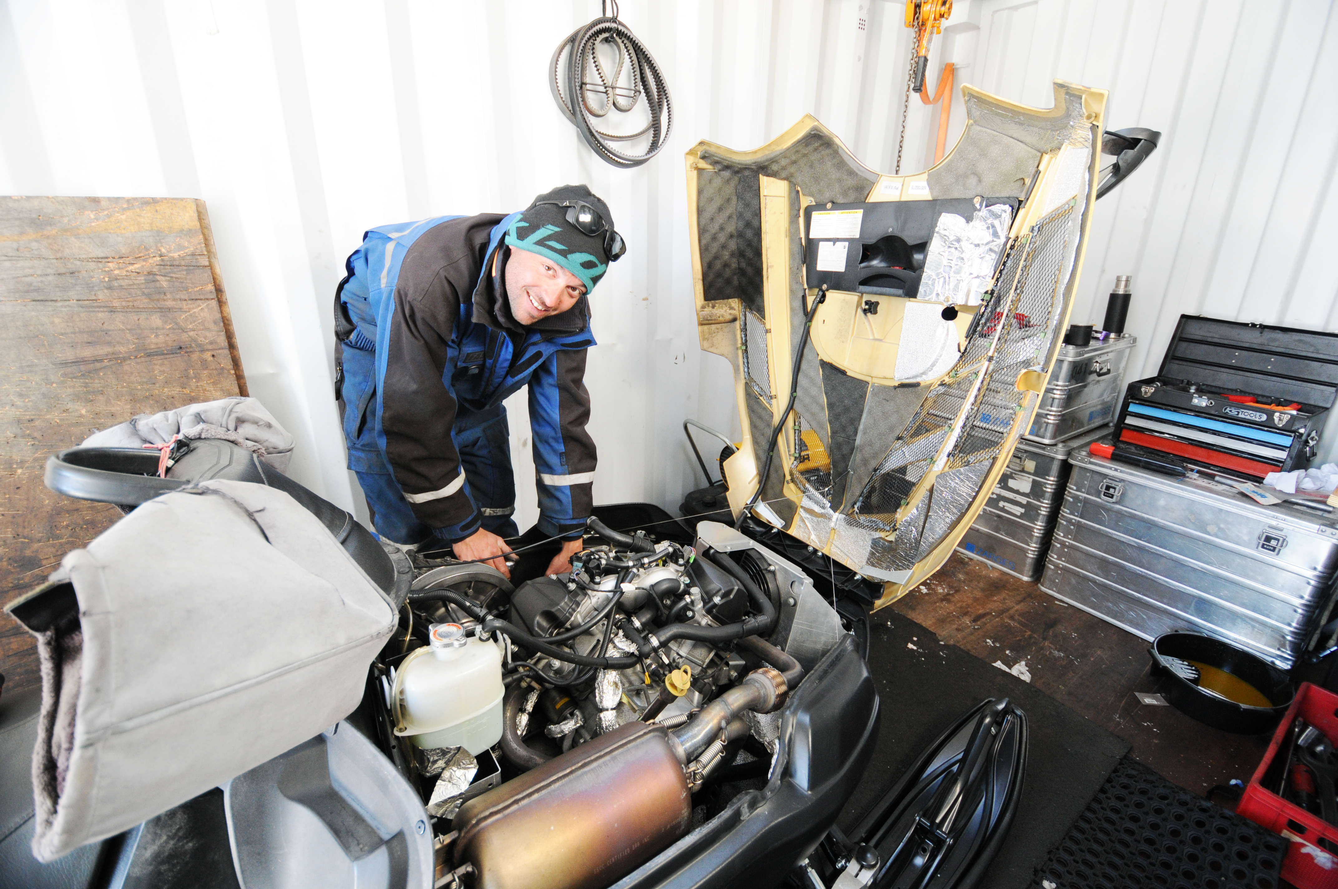 Yann the mechanic working on a ski-doo