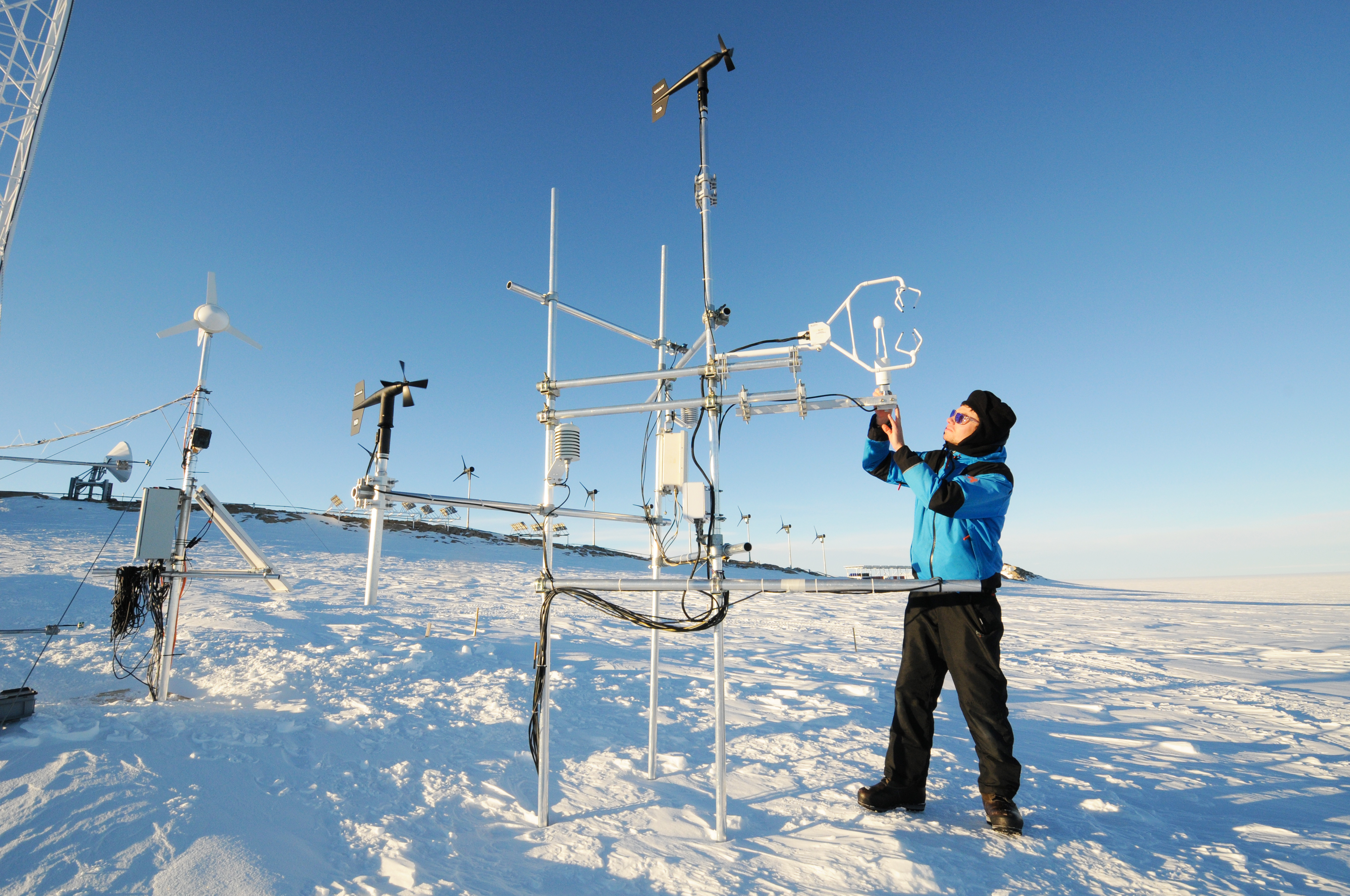 Armin Sigmund (EPFL) performs maintenance on a remote sensing station for the From Clouds to Ground project