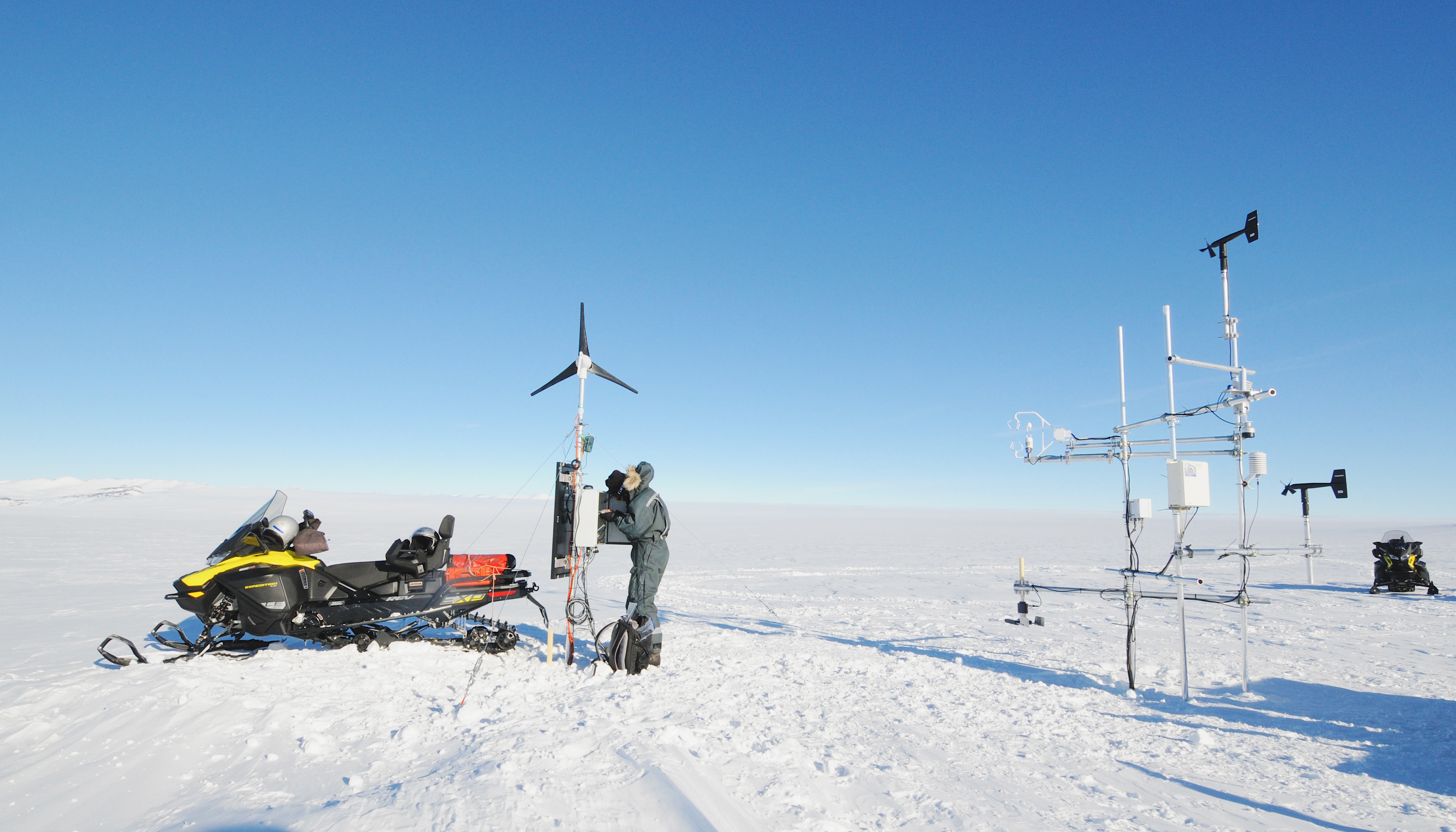 Armin Sigmund sets up a wind turbine to help power a remote sensing station
