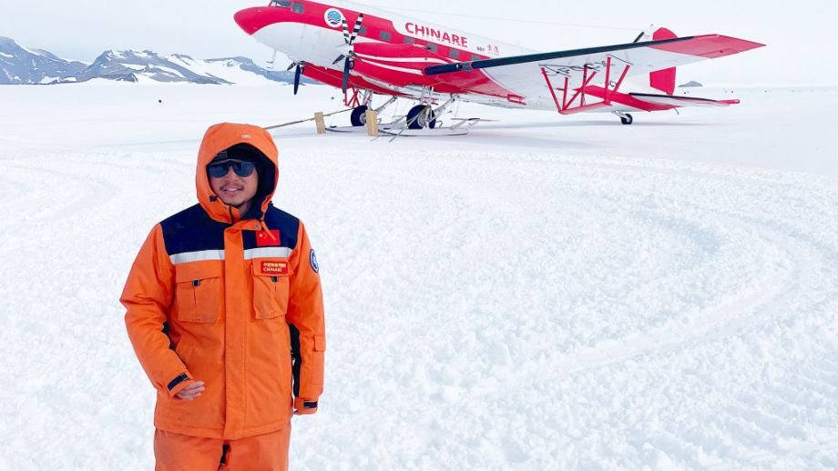 Kai Lu CHINARE scientist and Snow Eagle aircraft at Princess Elisabeth
