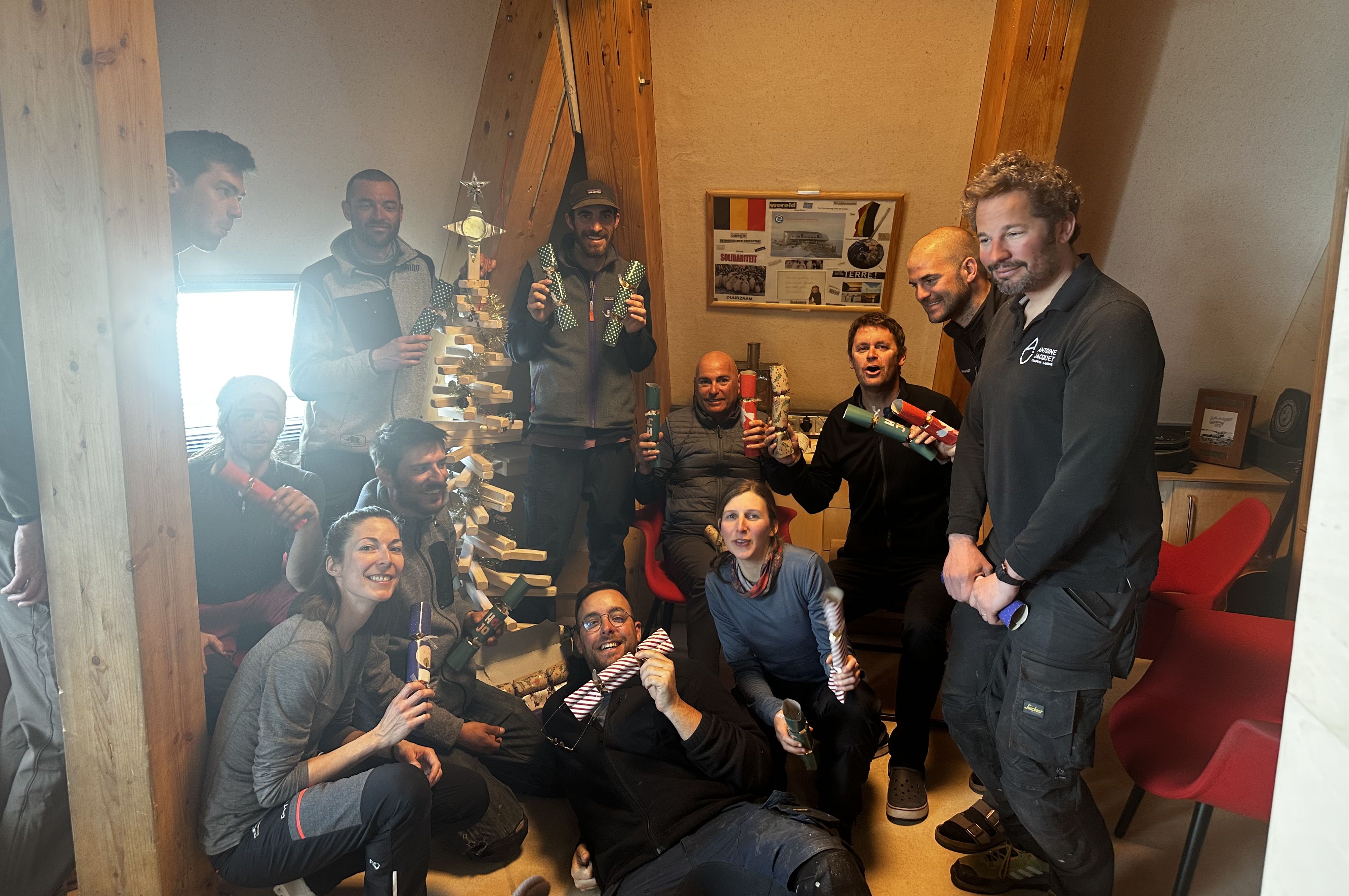 Members of the BELARE team exchange gifts on Christmas