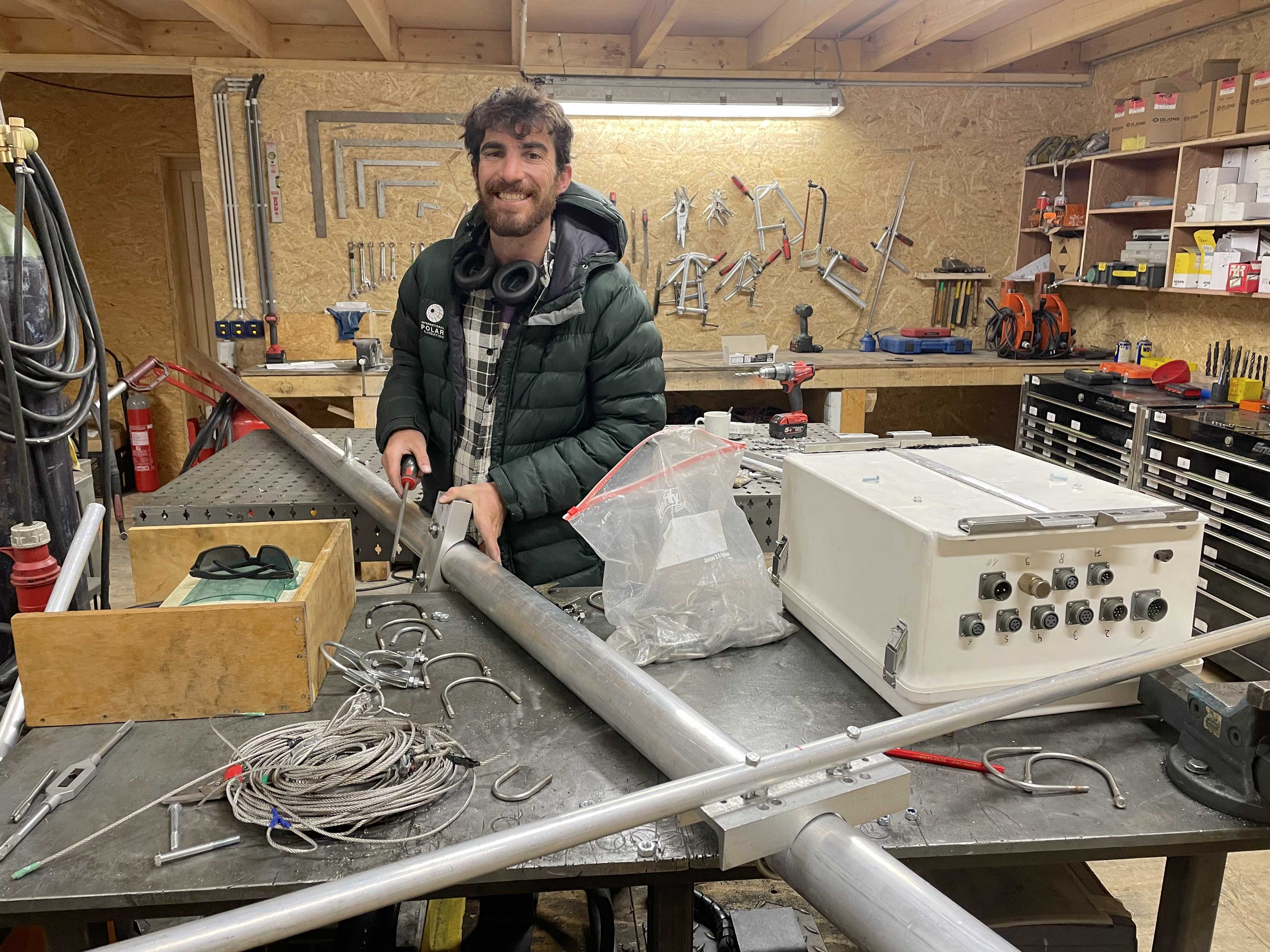 Simon Steffen Working on Automatic Weather Station in PEA Workshop