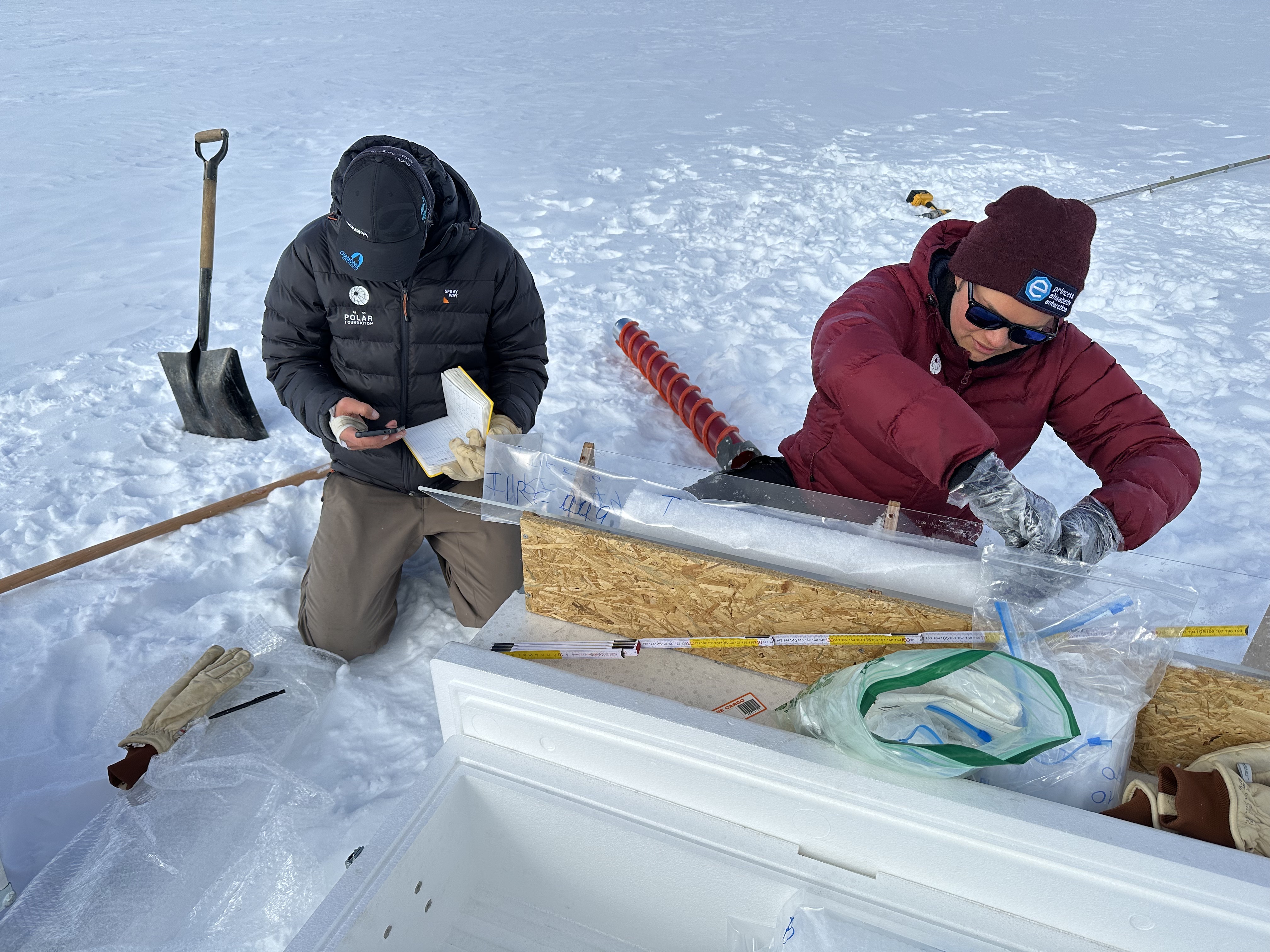 ULB scientist Sarah Wauthy and field guide Sebastian Corret prepare a snow core taken near PEA for the PASPARTOUT project