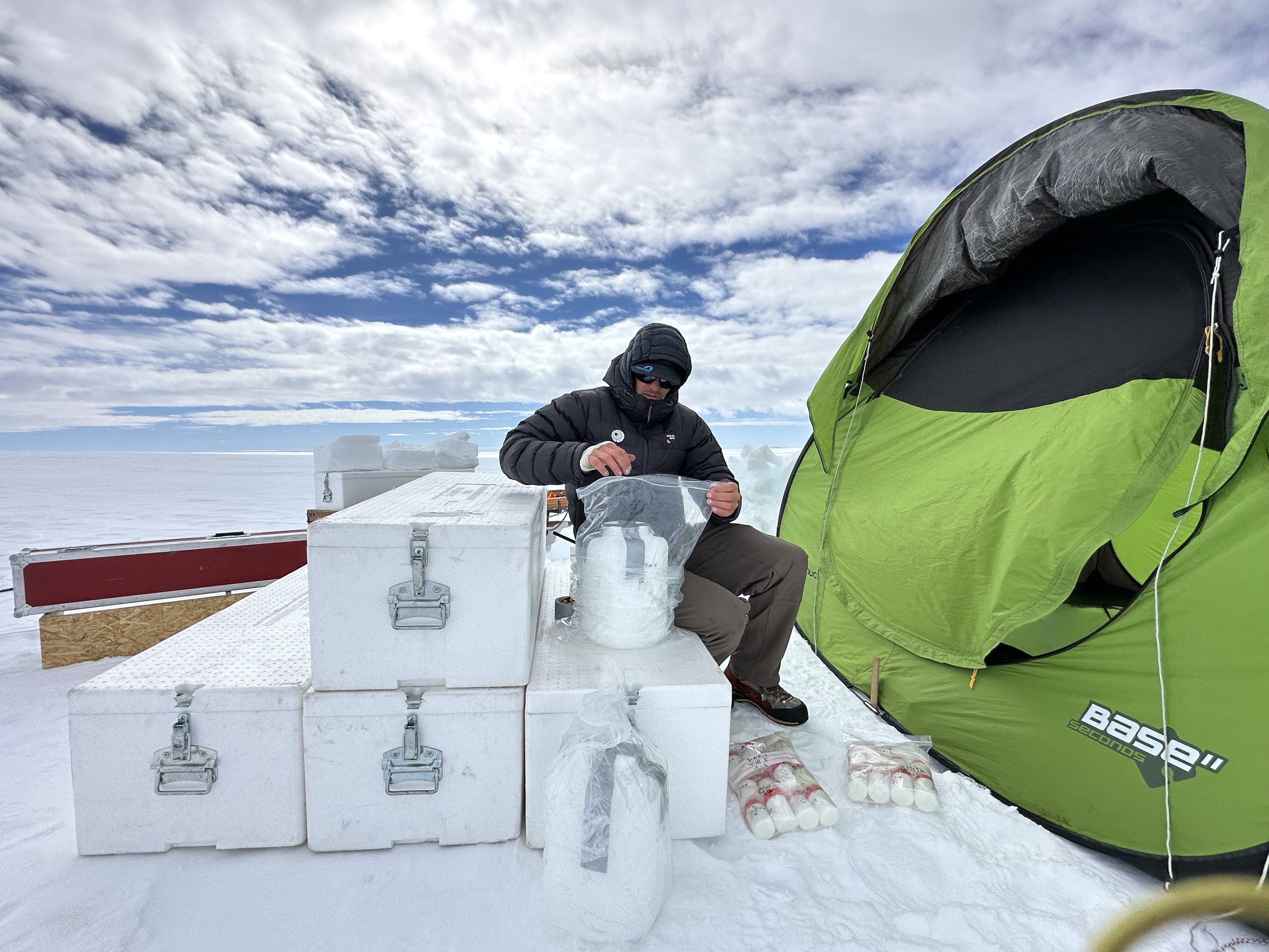 Sebastian Corret storing snow samples taken from a trench dug at at L0 Ice Rise for the PASPARTOUT project