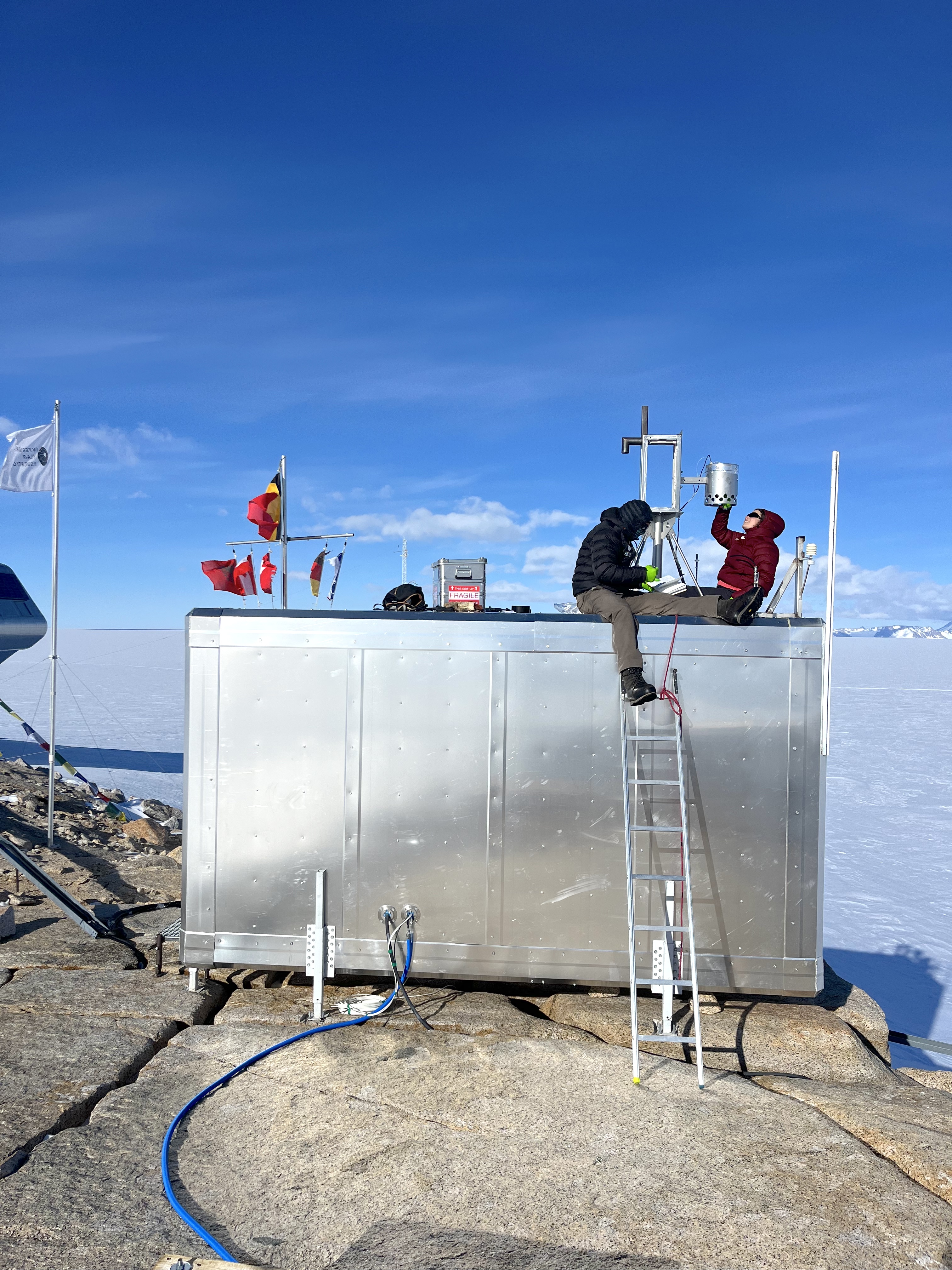 Sarah Wauthy (ULB) and Sebastien Corret  collect tubes from the Volatile Organic Compound (VOC) auto sampler installed on PEA’s south scientific shelter for the PASPARTOUT project
