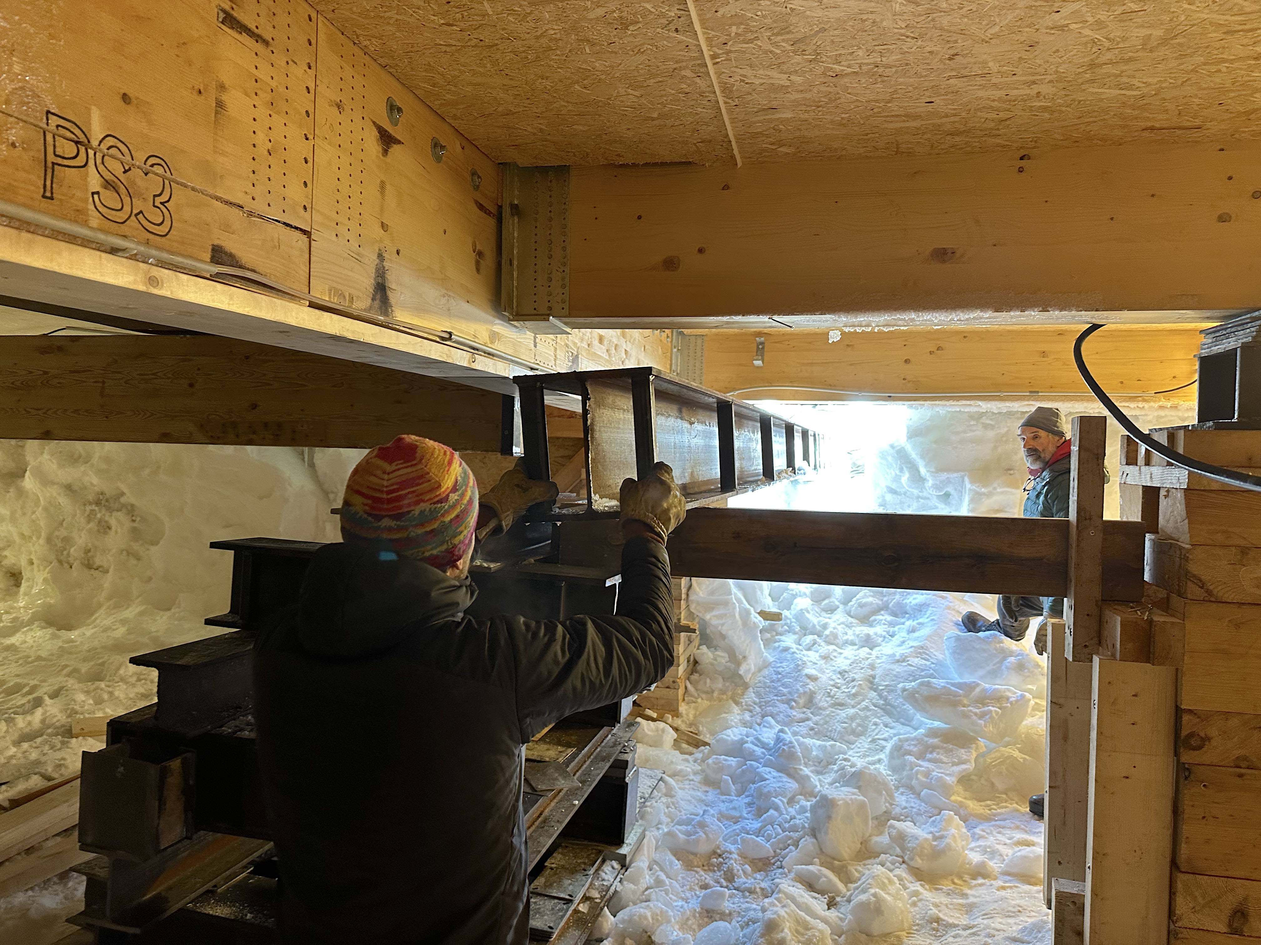 Carpenters guide in metal I-beam underneath station's annexes
