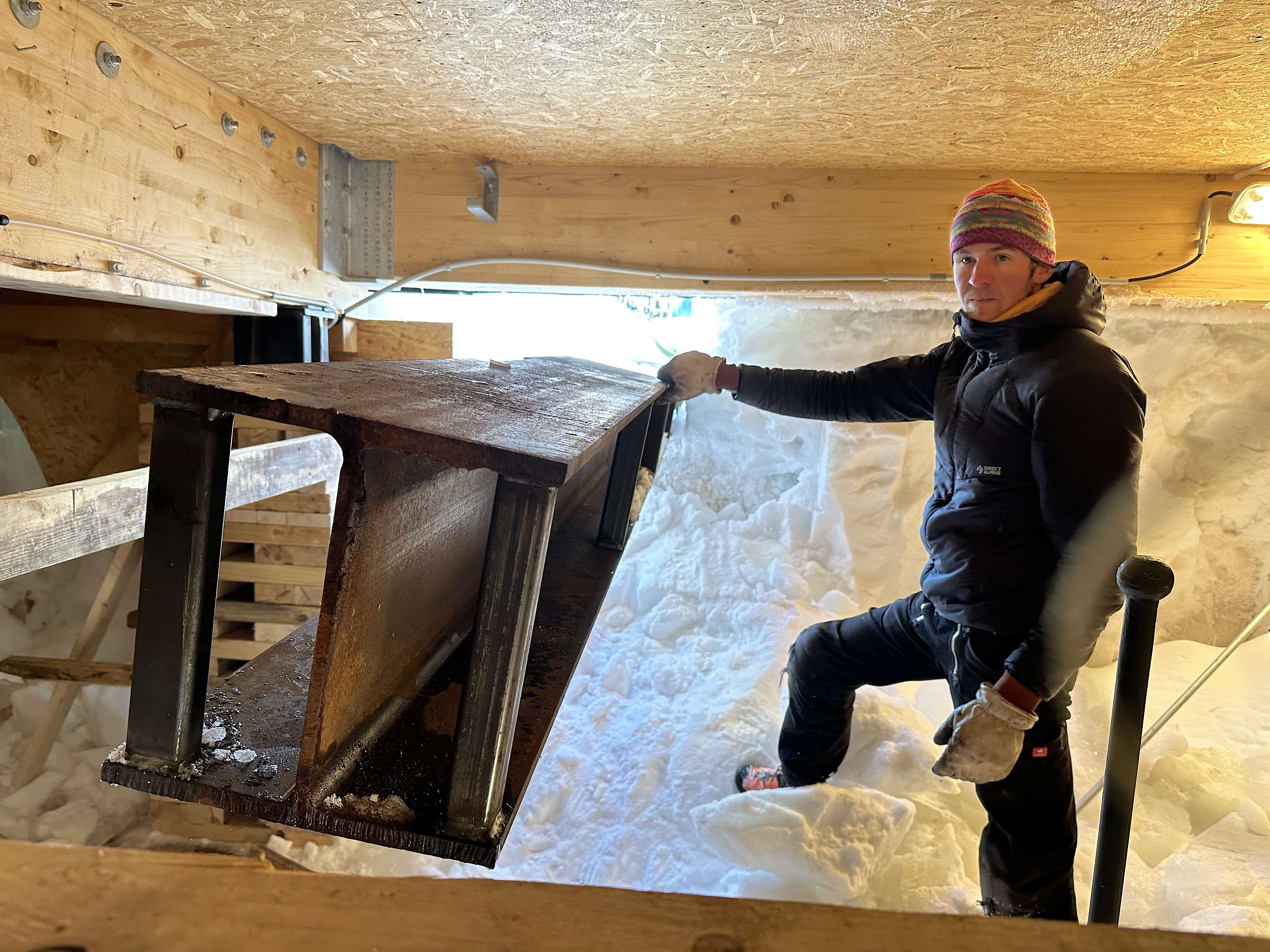 A steel I-beam is slid underneath the Princess Elsiabeth Antarctica's annex