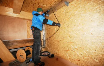 Johan Demuylder installs solar panels on the Pricness Elisabeth Antarctica's new garage