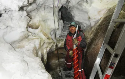 IPF President and Founder Alain Hubert doing maintenance on treated water crevasse form the water treatment unit