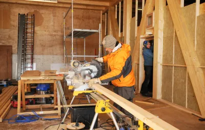 Mathieu the carpenter builds new walls in PEA's new garage