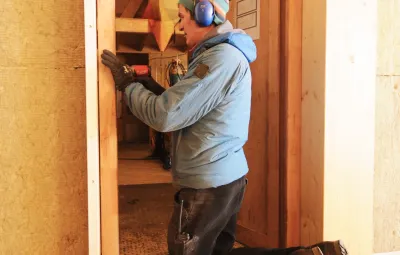 Tom the carpenter installs all the doors in PEA's new garage
