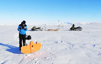 Armin Sigmund heads out into the field to check on a remote sensing station for the From Clouds to Ground project