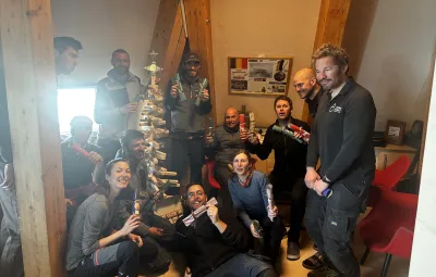 Members of the BELARE team exchange gifts on Christmas