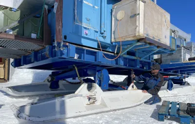 Mechanic repairing living container