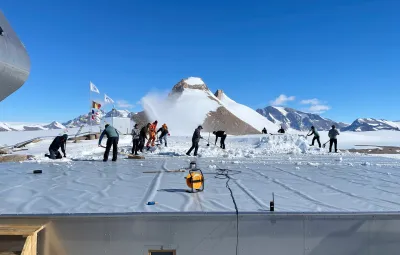 BELARE team clearing snow from the roof of PEA