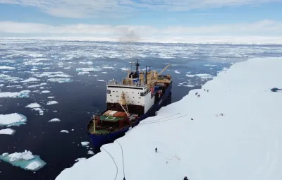 Cargo ship anchored along the ice shelf of Queen Maud Land.