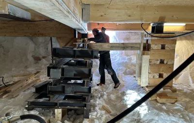 preapring to install steel I-beam undeneath PEA's annex