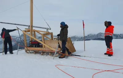 Lowering CDT device into the ocean at edge of ice shelf