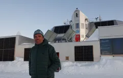 Alain Hubert poses in front of the Princess Elisabeth Antarctica, November 2023