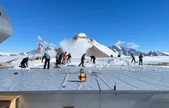 BELARE tema members remove snow from PEA roof
