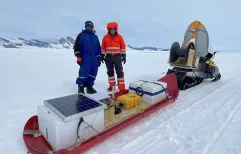 Ratnakar Gadi and Eric Rignot from UC Irvine pose with a radar seldge they used to image the King Baudoin Ice Shelf