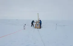 Drilling a hole in the King Baudoin Ice Shelf to take CDT measurements