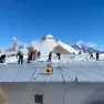 BELARE tema members remove snow from PEA roof