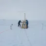 Drilling a hole in the King Baudoin Ice Shelf to take CDT measurements