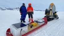 Ratnakar Gadi and Eric Rignot from UC Irvine pose with a radar seldge they used to image the King Baudoin Ice Shelf