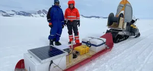Ratnakar Gadi and Eric Rignot from UC Irvine pose with a radar seldge they used to image the King Baudoin Ice Shelf